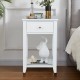 White bedside nightstand showcasing a clean design with a spacious drawer and open shelf for stylish storage solutions.